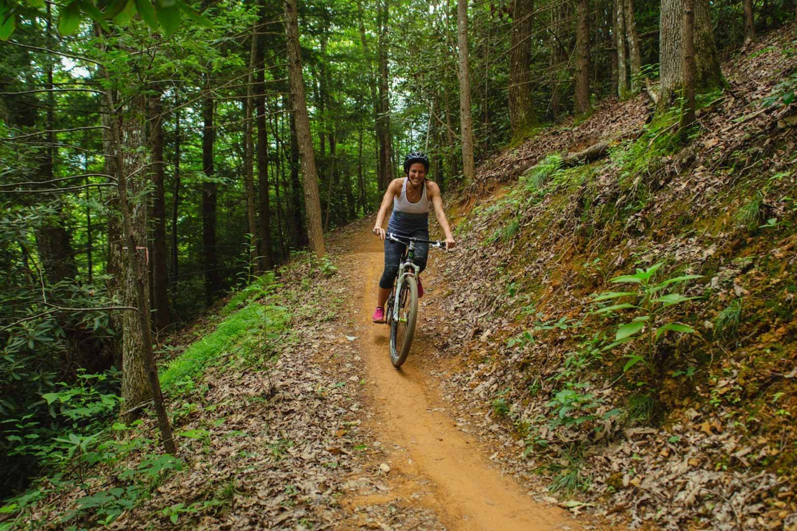 Mountain Biking on trail in woods